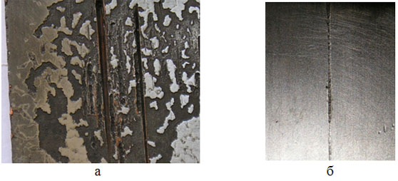 Разрушение покрытия в участках эрозии (а) и абразивного действия поверхности заготовки (б)
